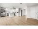 Open kitchen featuring a kitchen island, stainless steel appliances, and wood-look tile flooring at 1680 Lemon Bay Dr, Venice, FL 34293