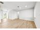 Bright living room with neutral paint, recessed lighting and light wood-look tile flooring at 1680 Lemon Bay Dr, Venice, FL 34293