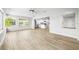 Inviting living room with natural light and open layout flowing into the modern kitchen at 1680 Lemon Bay Dr, Venice, FL 34293