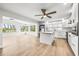 Open layout with island kitchen flows into the sunny living area overlooking the water at 1680 Lemon Bay Dr, Venice, FL 34293