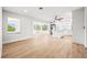 Bright and spacious living area connecting to the modern kitchen and showcasing beautiful flooring at 1680 Lemon Bay Dr, Venice, FL 34293
