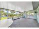 Spacious screened porch overlooking a canal at 1680 Lemon Bay Dr, Venice, FL 34293