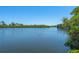 Scenic water view showcasing calm waters and lush greenery at 1680 Lemon Bay Dr, Venice, FL 34293