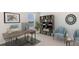 Stylish home office featuring modern desk, comfortable seating, bookcase, and plenty of natural light at 17255 Whiskey Creek Trl, Parrish, FL 34219