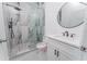 Beautiful bathroom featuring a glass enclosed shower with a modern vanity and fixtures at 18182 Steele Ave, Port Charlotte, FL 33948
