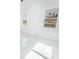 Sunlit bedroom with modern tile floors, white walls, and a view of the outdoors through two windows at 18182 Steele Ave, Port Charlotte, FL 33948
