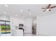 Modern kitchen with white cabinets, stainless steel appliances, and an open layout, perfect for entertaining at 18182 Steele Ave, Port Charlotte, FL 33948
