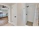 Renovated bathroom with modern shower and neutral tile, door to bedroom at 2301 Cass St, Sarasota, FL 34231