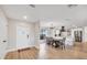 Bright, open-concept foyer leading into a dining area and modern kitchen with stainless appliances at 2301 Cass St, Sarasota, FL 34231