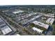 Aerial photo showcases buildings, local businesses, and the cityscape surrounded by trees at 2301 Cass St, Sarasota, FL 34231