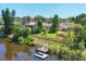 Aerial view of the beautiful waterfront property with private dock and lush landscaping at 2410 Tanglewood Dr, Sarasota, FL 34239