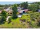 Aerial view of backyard featuring in-ground pool, fire pit, and ample outdoor seating at 2410 Tanglewood Dr, Sarasota, FL 34239