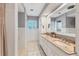 Bathroom features double sinks, tiled floors and walls, and plenty of counter space at 2410 Tanglewood Dr, Sarasota, FL 34239