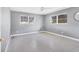 Bedroom with neutral walls, a ceiling fan, and two large windows providing natural light at 2410 Tanglewood Dr, Sarasota, FL 34239