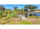 Charming dock with rope accents, inviting residents to enjoy waterfront living and scenic views at 2410 Tanglewood Dr, Sarasota, FL 34239