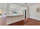 Kitchen with a large island with seating and bright white cabinetry at 2410 Tanglewood Dr, Sarasota, FL 34239