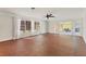 Spacious living room with tile flooring and large windows and access to the patio at 2410 Tanglewood Dr, Sarasota, FL 34239