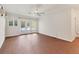 Sunny living room featuring french doors with outdoor access and tile flooring at 2410 Tanglewood Dr, Sarasota, FL 34239