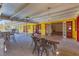 Outdoor dining area with brick flooring and view into spacious living room at 2410 Tanglewood Dr, Sarasota, FL 34239