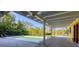 Refreshing pool surrounded by a spacious brick patio and lush landscaping, ideal for relaxation at 2410 Tanglewood Dr, Sarasota, FL 34239