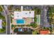 Overhead view of community amenities, including pool, shuffleboard, and boat docks at 2531 Riverbluff Pkwy # V181, Sarasota, FL 34231