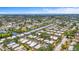 Aerial view of the community with waterfront access, mature trees, and beautifully maintained landscaping at 2531 Riverbluff Pkwy # V181, Sarasota, FL 34231