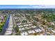 Scenic aerial view of a vibrant community, showcasing lush landscaping, waterways and neighborhood layout at 2531 Riverbluff Pkwy # V181, Sarasota, FL 34231