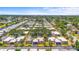 Aerial view showcasing a community of homes with lush landscaping and mature trees throughout at 2531 Riverbluff Pkwy # V181, Sarasota, FL 34231
