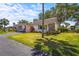 Charming villa with stone accents, carport, and beautifully manicured lawn at 2531 Riverbluff Pkwy # V181, Sarasota, FL 34231