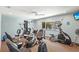 Well-lit gym featuring stationary bikes, elliptical, and weight training equipment at 2531 Riverbluff Pkwy # V181, Sarasota, FL 34231