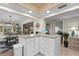 Open kitchen featuring breakfast bar and seamless flow to dining and living areas at 2531 Riverbluff Pkwy # V181, Sarasota, FL 34231