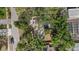 Aerial view of a home surrounded by mature trees and landscaping at 2535 Floyd St, Sarasota, FL 34239