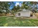 Backyard with patio, lawn and sliding glass doors providing indoor-outdoor living at 2535 Floyd St, Sarasota, FL 34239