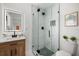 Bathroom features sleek glass shower, and modern vanity with updated mirror at 2535 Floyd St, Sarasota, FL 34239