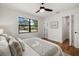Bright bedroom with wood floors, ceiling fan, and view to the outside at 2535 Floyd St, Sarasota, FL 34239