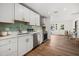 Updated kitchen featuring white cabinetry, stainless steel appliances, and stylish backsplash for a modern look at 2535 Floyd St, Sarasota, FL 34239