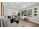 Bright living room with recessed lighting, wood floors and large window at 2535 Floyd St, Sarasota, FL 34239
