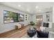 Bright living room with wood floors, large windows, and comfortable seating arrangement at 2535 Floyd St, Sarasota, FL 34239