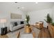 Modern living room with sleek furnishings, a neutral color palette, and natural light creating a welcoming space at 2535 Floyd St, Sarasota, FL 34239