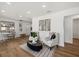 Open concept living room boasts modern decor, wood floors, and great natural light at 2535 Floyd St, Sarasota, FL 34239