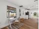 Bright office space with a large window, desk, and view into the kitchen at 2535 Floyd St, Sarasota, FL 34239