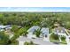 Wide shot of the neighborhood showing proximity to lush surroundings at 2598 Wood St, Sarasota, FL 34237