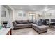 Comfortable living area featuring a plush gray sectional sofa and stylish decor at 2598 Wood St, Sarasota, FL 34237