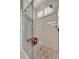 Elegant glass enclosed walk-in shower with a tiled floor and seat at 3103 77Th E Dr, Sarasota, FL 34243