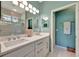 Spacious bathroom with double vanity, and glass enclosed walk-in shower at 3103 77Th E Dr, Sarasota, FL 34243