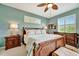 Primary bedroom features ceiling fan, lamps, and a bench seat at 3103 77Th E Dr, Sarasota, FL 34243