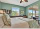 Comfortable bedroom with view of the lake and outdoor patio at 3103 77Th E Dr, Sarasota, FL 34243