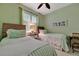Cozy bedroom with twin beds, wicker headboards, and a cute side table with lamp at 3103 77Th E Dr, Sarasota, FL 34243