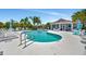 A community pool offers an area to cool off and a place to relax with the neighbors at 3103 77Th E Dr, Sarasota, FL 34243