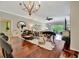 Well-lit dining area with wood floors and views of the open-concept living area at 3103 77Th E Dr, Sarasota, FL 34243